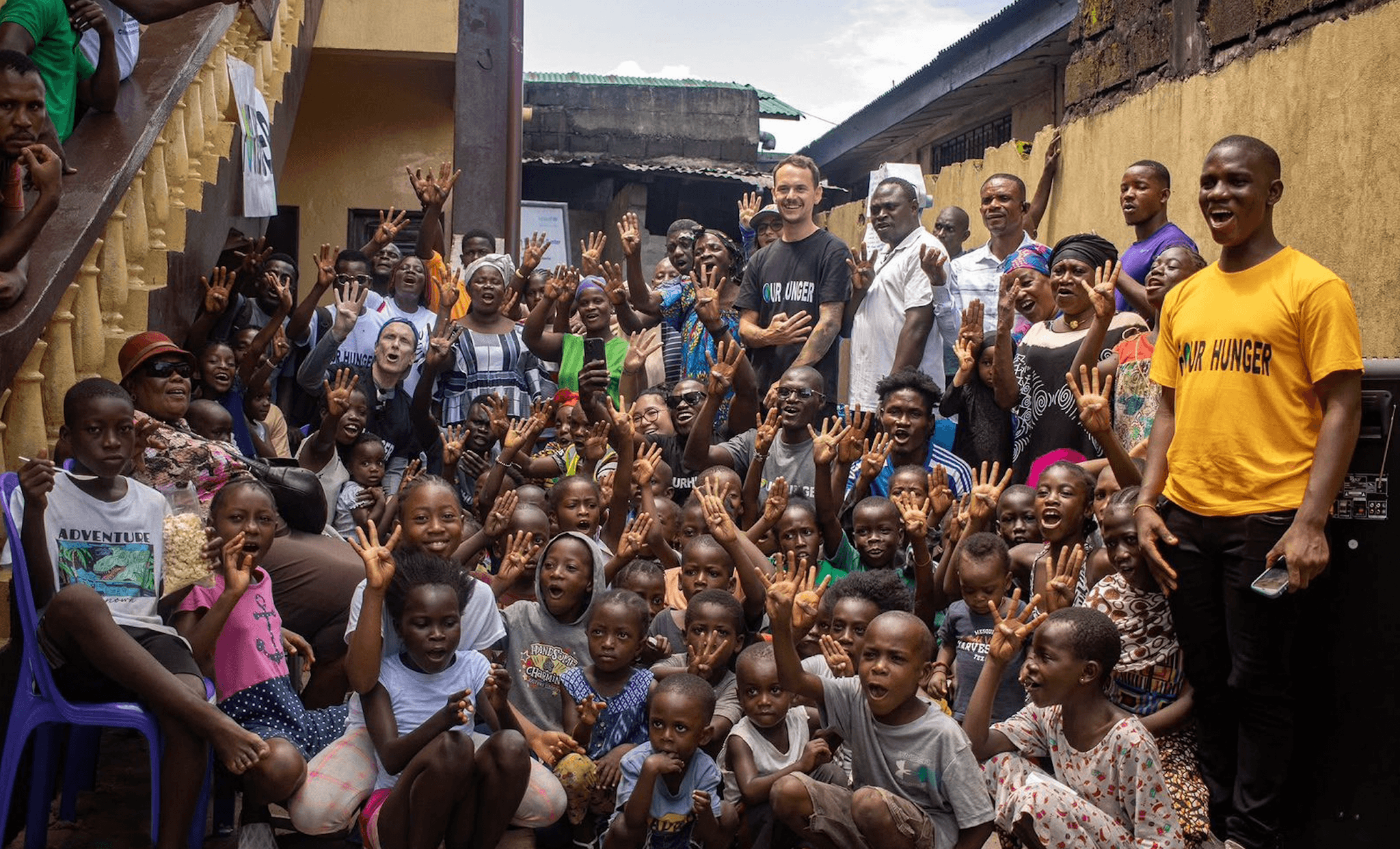 Four Hunger field team and children